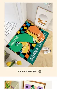 Detail of a colorful door mat with a trendy quote inside a modern home entrance