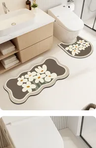 Floral diatom mud bathroom mat set including U-shaped toilet rug and matching sink mat.