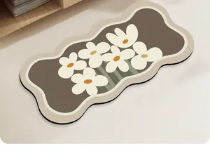 Detailed top view of wavy diatomaceous earth bath mat with white daisy floral patterns