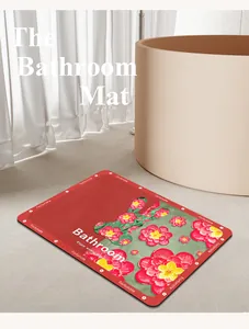 Gros plan d'un tapis de bain en terre de diatomée rouge avec illustration lapin floral