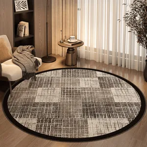 Modern circular looped pile rug with beige plaid pattern in a cozy living room setting.