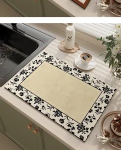 Detail view of an American style kitchen absorbent mat with black floral pattern
