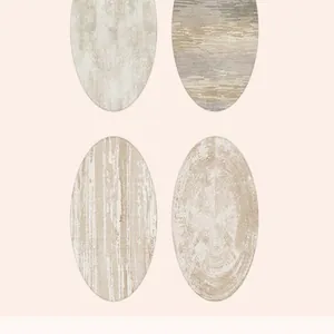 Detail view of four cream-style round carpets with various modern artistic textures
