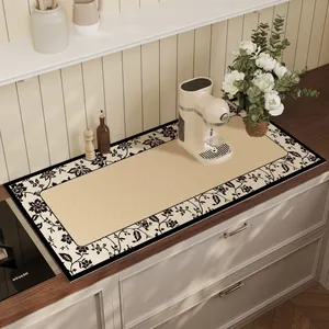 Detailed macro view of American style floral absorbent mat on wooden kitchen countertop