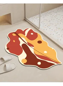 Alfombra de baño absorbente en forma de hoja con patrones geométricos cálidos e irregulares