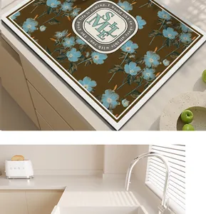 Detail view of PVC leather kitchen mat with blue floral pattern and smile design