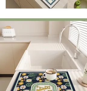Close-up of floral PVC leather kitchen drying mat on white counter top