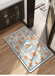 Modern floral absorbent bath mat with orange lily print in elegant bathroom setting