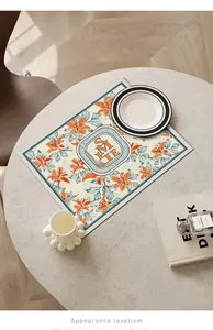 Elegant Nordic style floral leather placemat set on a minimalist marble dining table