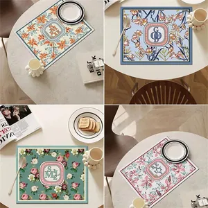 Set of 4 Nordic style floral leather placemats for luxury dining tables.