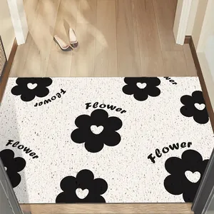 Modern floral anti-slip doormat with Flower text print on white speckled background
