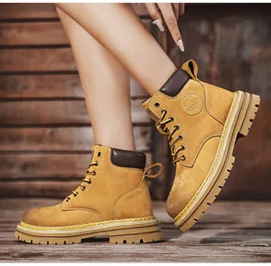 Close-up of yellow leather platform boots with rugged sole and contrast stitching