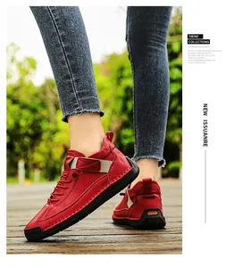 Close-up of red hand-stitched leather shoes for women featuring durable soft soles