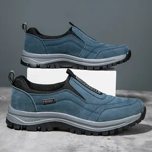 Side view of blue suede outdoor sports shoes for men with thick non-slip rubber soles