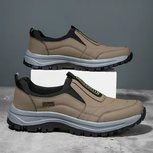 Detailed side view of khaki men's outdoor casual shoes featuring thick slip-resistant soles