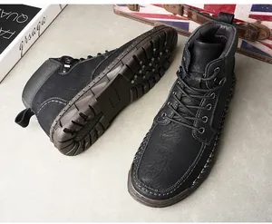 Detailed view of black British style men's Martin boots with thick rubber sole