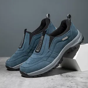 Close-up detail of blue suede outdoor men's slip-on shoes with durable thick soles