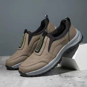 Detailed side view of brown men's outdoor casual sneakers with thick soles