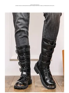 Detailed view of men's black gothic punk combat boots with buckle straps and metal toe cap