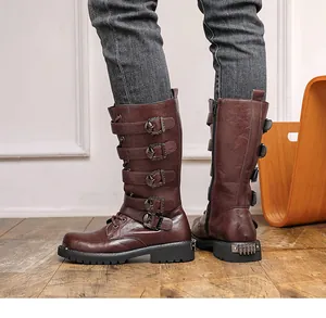 Vintage brown high-top motorcycle boots with multi-buckle straps and studded heel detail