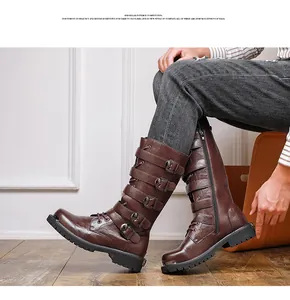 Close-up detail of vintage brown leather motorcycle boots with multiple buckle straps
