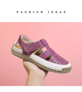 Side view of purple and white hollow-out leather sandals for women with soft rubber sole.