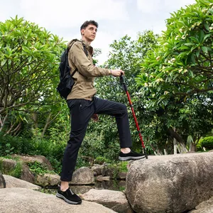 Professional men's waterproof outdoor hiking shoes featured in a rugged nature setting
