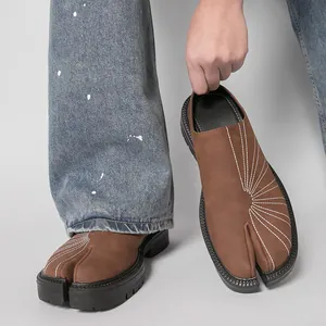 Stylish brown split-toe tabi mules for men with thick platform soles and white stitching
