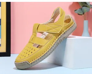 Side view showing breathable hollow-out details of yellow closed-toe sandals