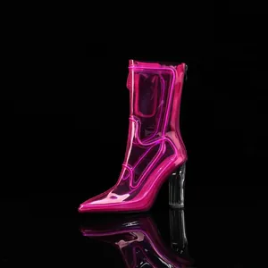Detailed view of neon pink transparent high-heeled boots with LED glowing strips.