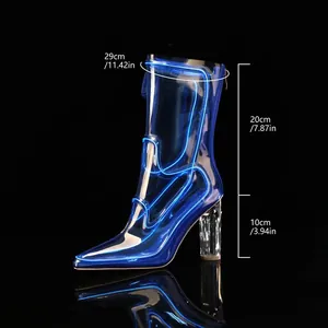 Detail view of luminous blue transparent chunky heel boots with shaft and heel dimensions