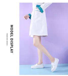Side view of white nurse shoes with tassel detail worn with medical uniform.