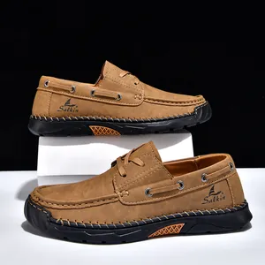 Detail of tan PU leather men's casual shoes with hand-stitched seams and anti-slip sole
