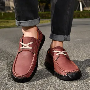 Detail of brown PU leather men's work shoes featuring durable hand-stitched seams