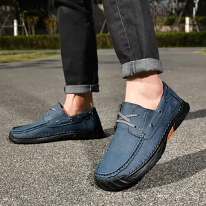 Detailed view of blue men's casual PU leather shoes with hand-stitched details