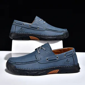 Detailed side view of blue hand-stitched men's casual PU leather loafers