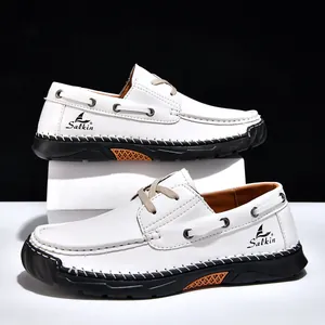 Detailed view of white men's casual leather shoes with hand-stitched contrast seams
