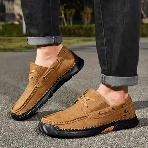 Detail view of men's brown PU leather casual loafers with hand-stitched durable sole