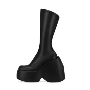 Modern black platform wedge boots featuring square toe and stretch fabric mid-calf design