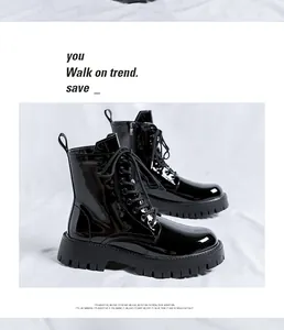 Detailed view of glossy black high-top Martin boots for men in British style.