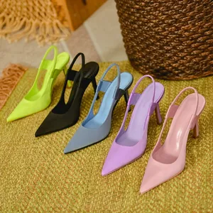Multiple colors of satin pointed toe slingback pumps displayed on a woven mat