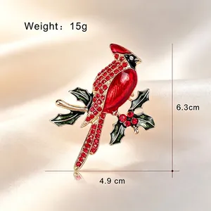 Red cardinal bird brooch with sparkling rhinestones and green enamel leaves