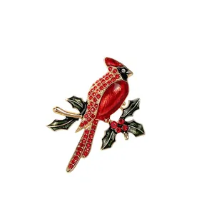 Elegant red cardinal bird brooch featuring sparkling rhinestones on a holly branch