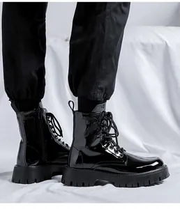 Detailed macro view of shiny black patent leather Martin boots for men with side zipper