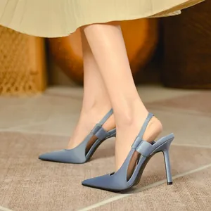 Elegant blue satin pointed-toe slingback high heels with bow detail shown on a model