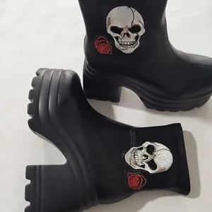 Gothic style black platform high-heel boots with skull and rose embroidery detail