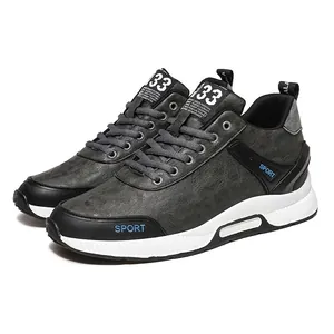 Close-up of grey men's hidden height increasing sports shoes with soft leather finish.