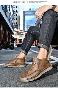 Detailed view of stylish brown leather men's outdoor casual mid-top boots in urban setting
