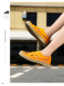 Detailansicht der orangefarbenen, handgenähten, atmungsaktiven Outdoor-Lochschuhe für Damen.