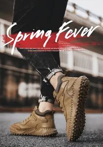 Detailed view of men's high-top leather outdoor boots with anti-slip spiked soles.